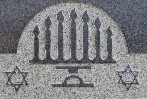 Jewish headstone with menorah
